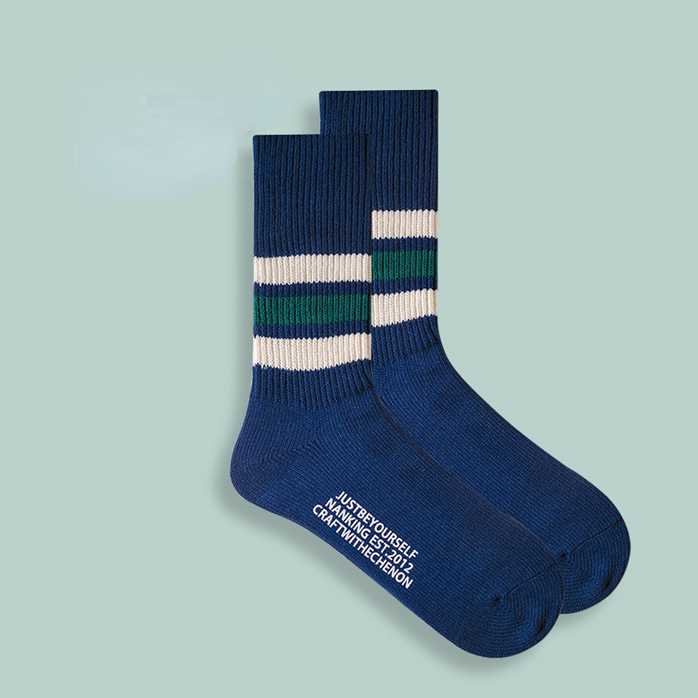 Chaussettes longues rétro rayées de couleur unie épaissies en coton peigné