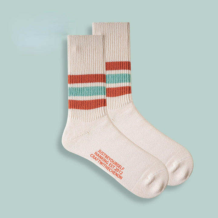 Chaussettes longues rétro rayées de couleur unie épaissies en coton peigné