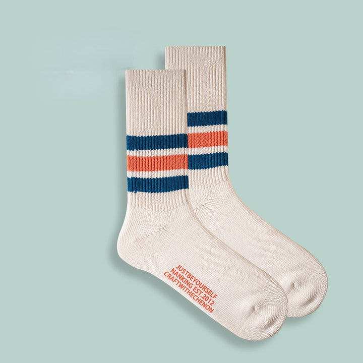 Chaussettes longues rétro rayées de couleur unie épaissies en coton peigné