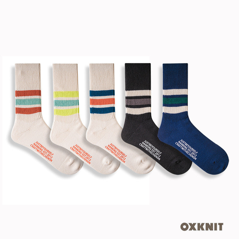 Chaussettes longues rétro rayées de couleur unie épaissies en coton peigné