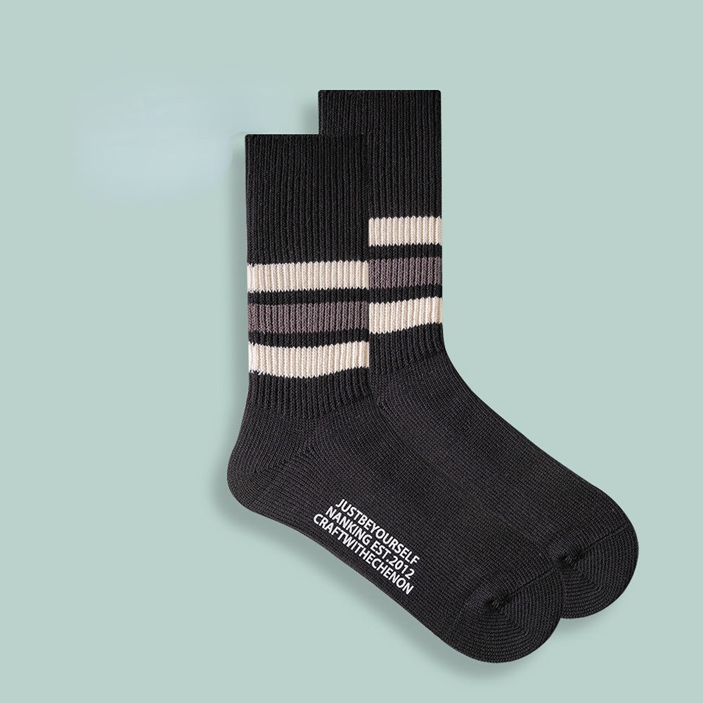 Chaussettes longues rétro rayées de couleur unie épaissies en coton peigné